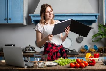 student prepares vegetarian salad